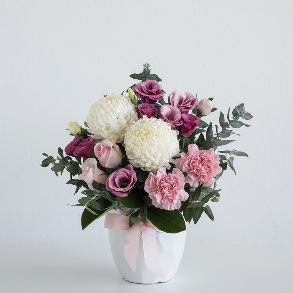 very popular pastel flowers in white geometric vase