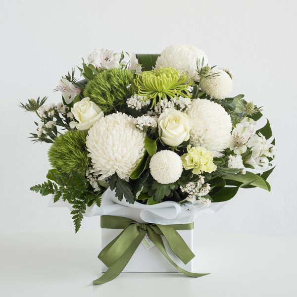 White and green flowers in a box arrangement